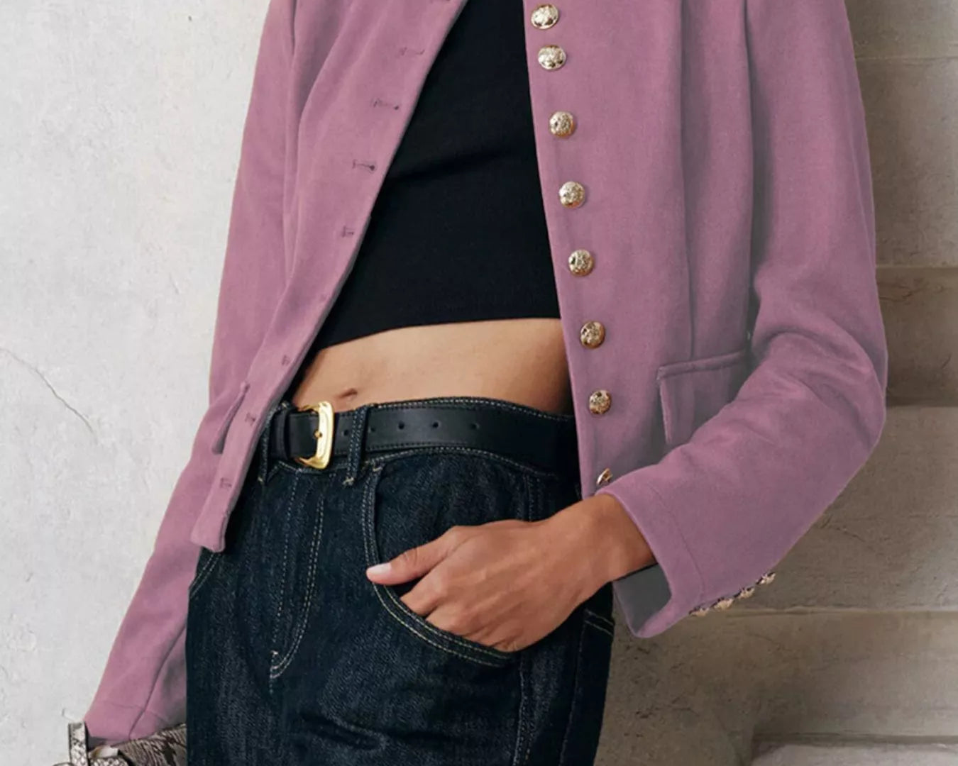 NEWYORKLISTED Style Collection Person wearing a pink blazer with gold buttons, black top, and jeans against a neutral background