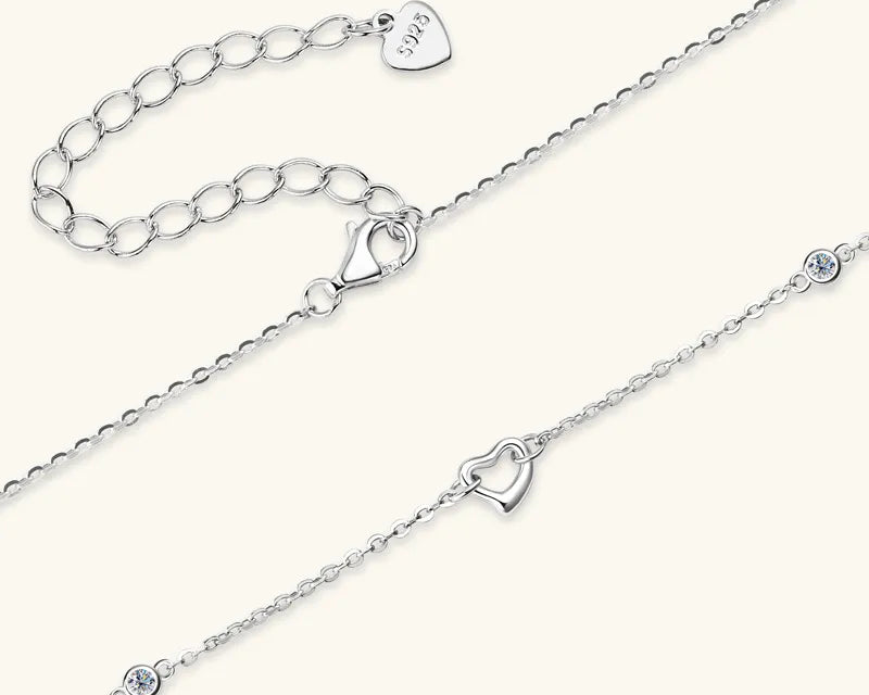 NEWYORKLISTED Valentine’s Day Specials: Two silver anklets with heart-shaped charms on a white background