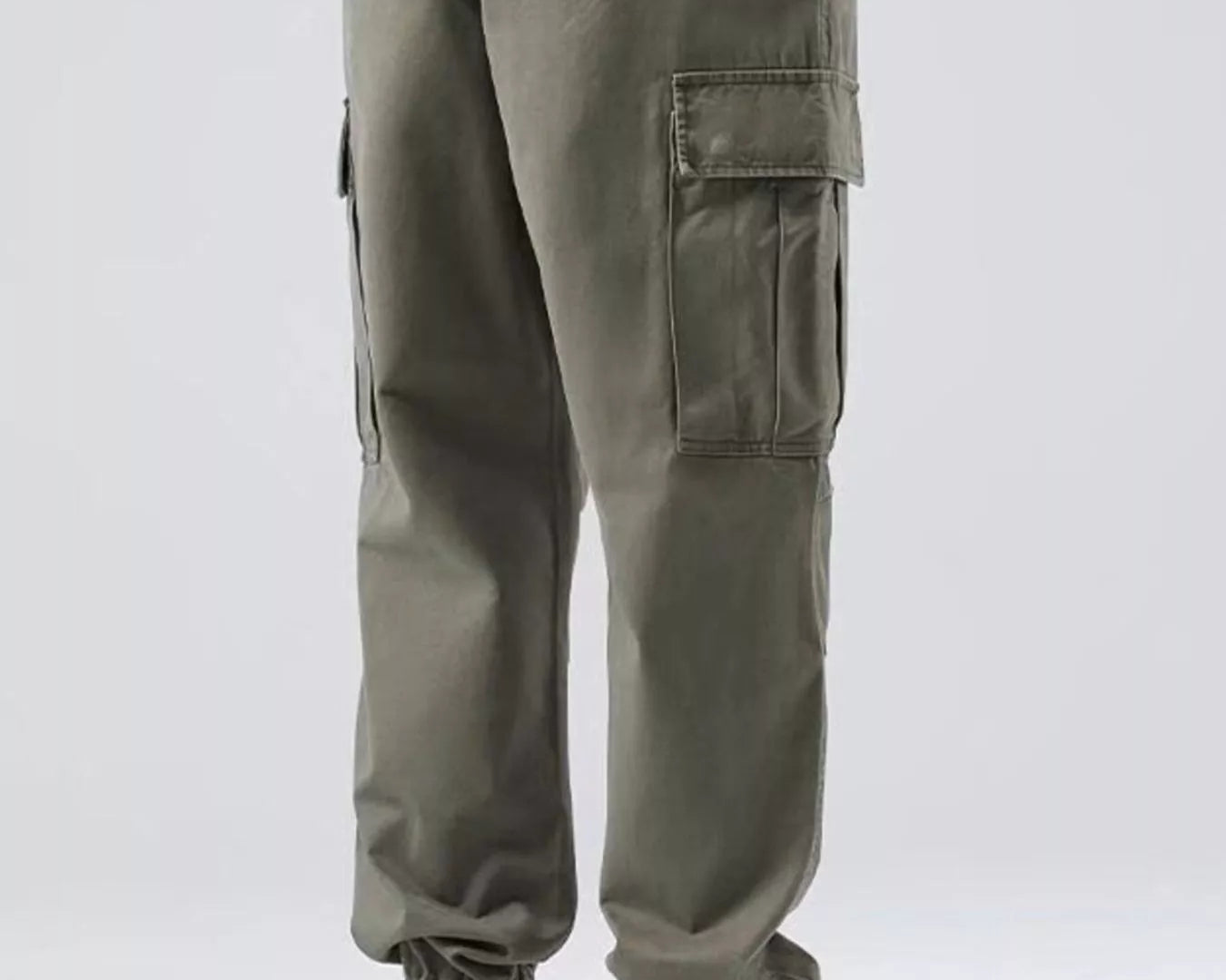 NEWYORKLISTED ATLAS MEN'S COLLECTION: Person wearing olive green cargo pants with a white background