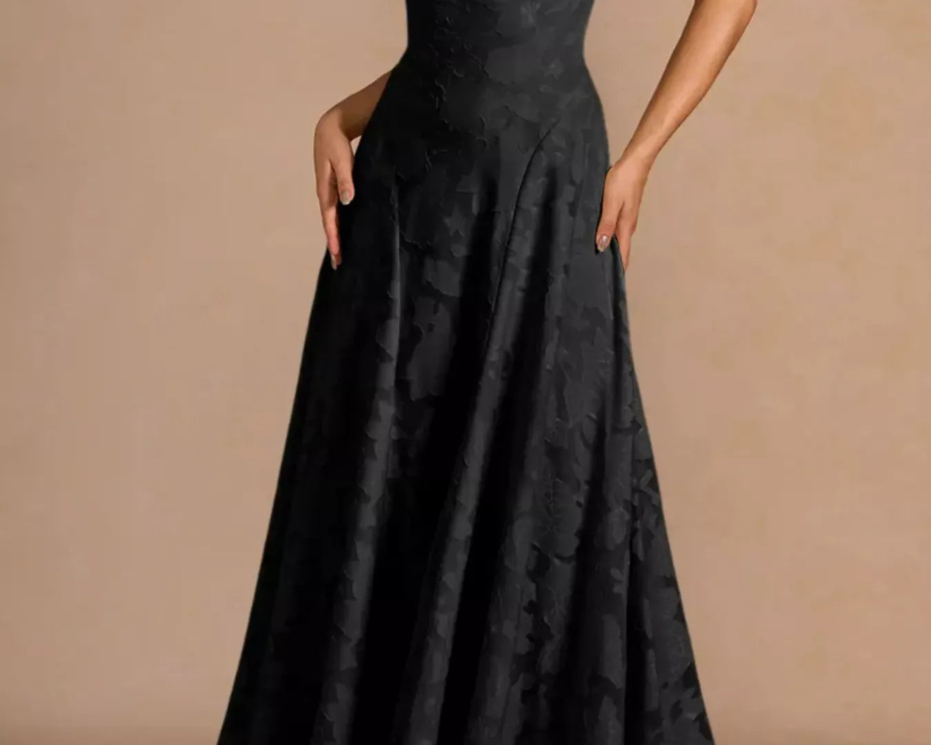 NEWYORKLISTED STYLE COLLECTION: Black evening gown on a beige background