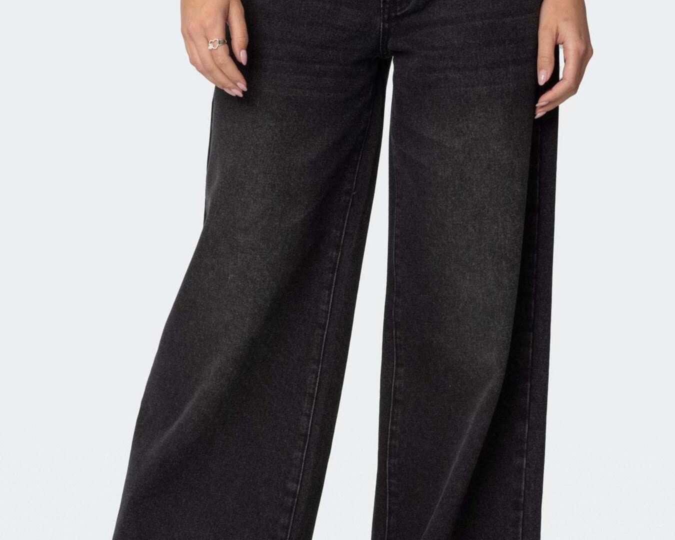 NEWYORKLISTED STYLE COLLECTION: Black wide-leg jeans worn by a person on a white background