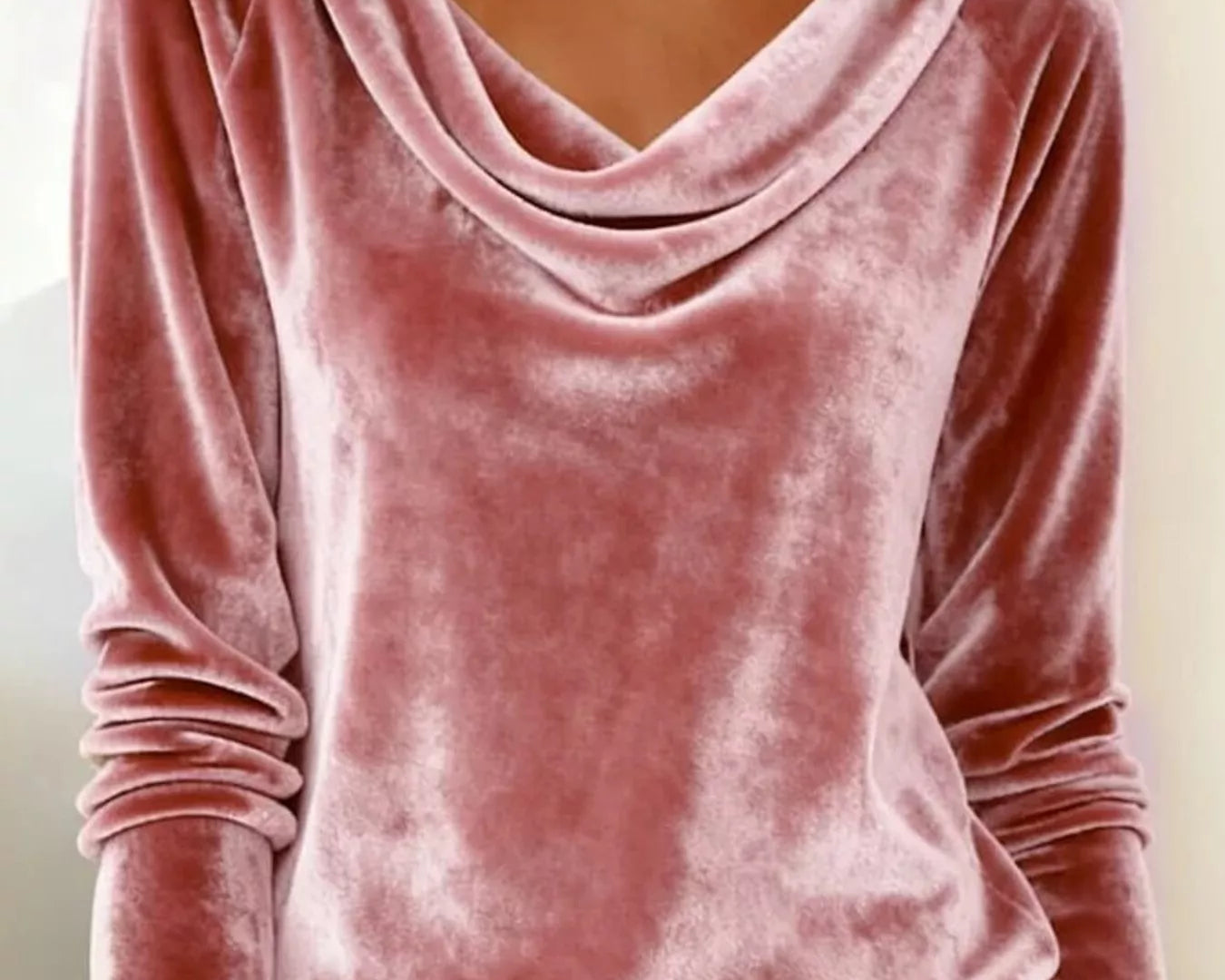 NEWYORKLISTED STYLE COLLECTION: Pink velvet long-sleeve top worn by a person with a neutral background