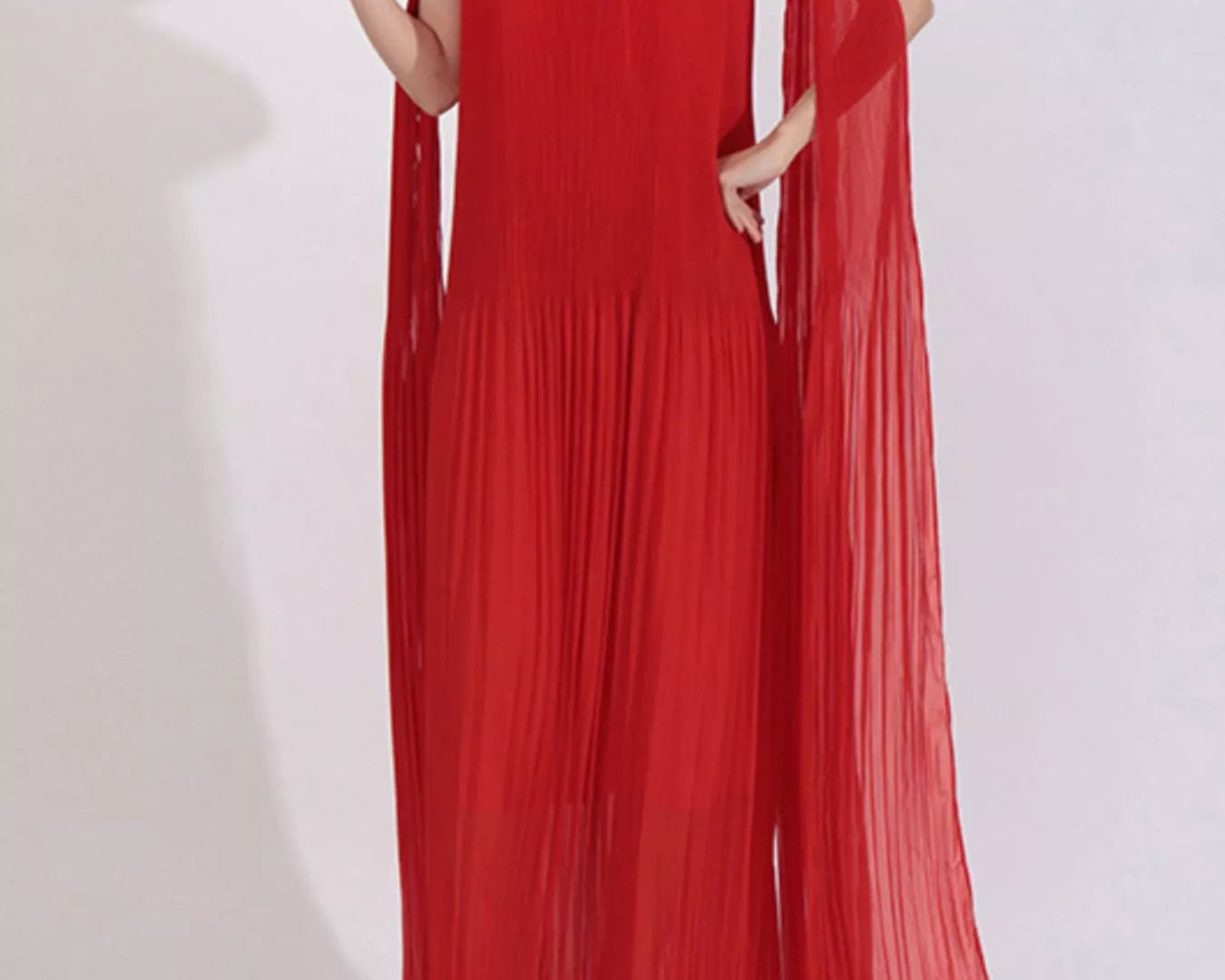 NEWYORKLISTED STYLE COLLECTION: Red off-shoulder dress with floral details on a white background