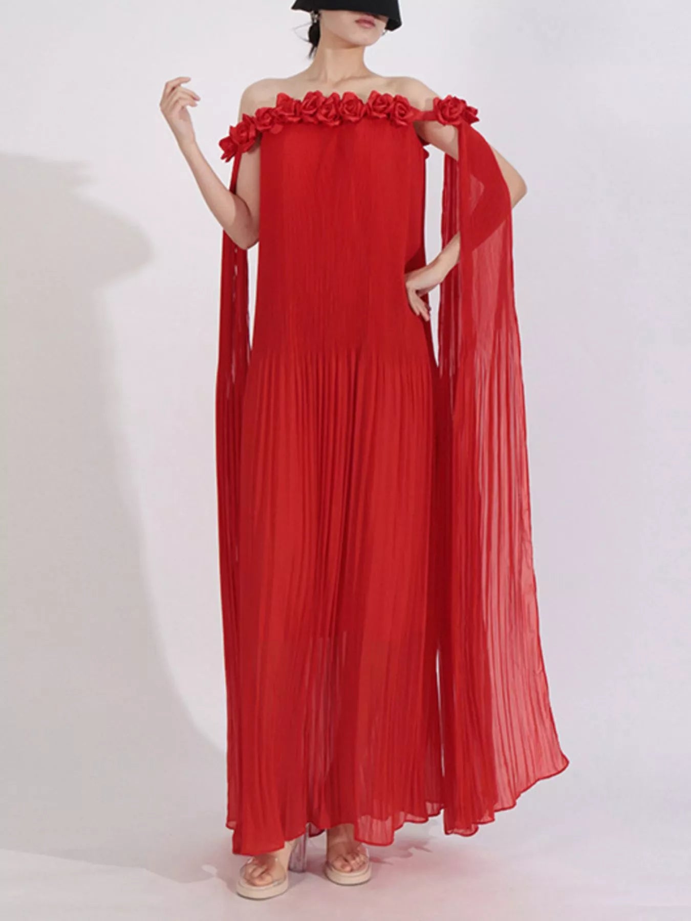 NEWYORKLISTED STYLE COLLECTION: Red off-shoulder dress with floral details on a white background