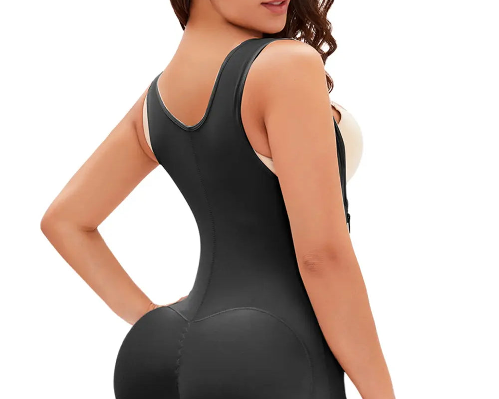 NEWYORKLISTED Intimate Apparel: Woman wearing a black shapewear bodysuit on a white background