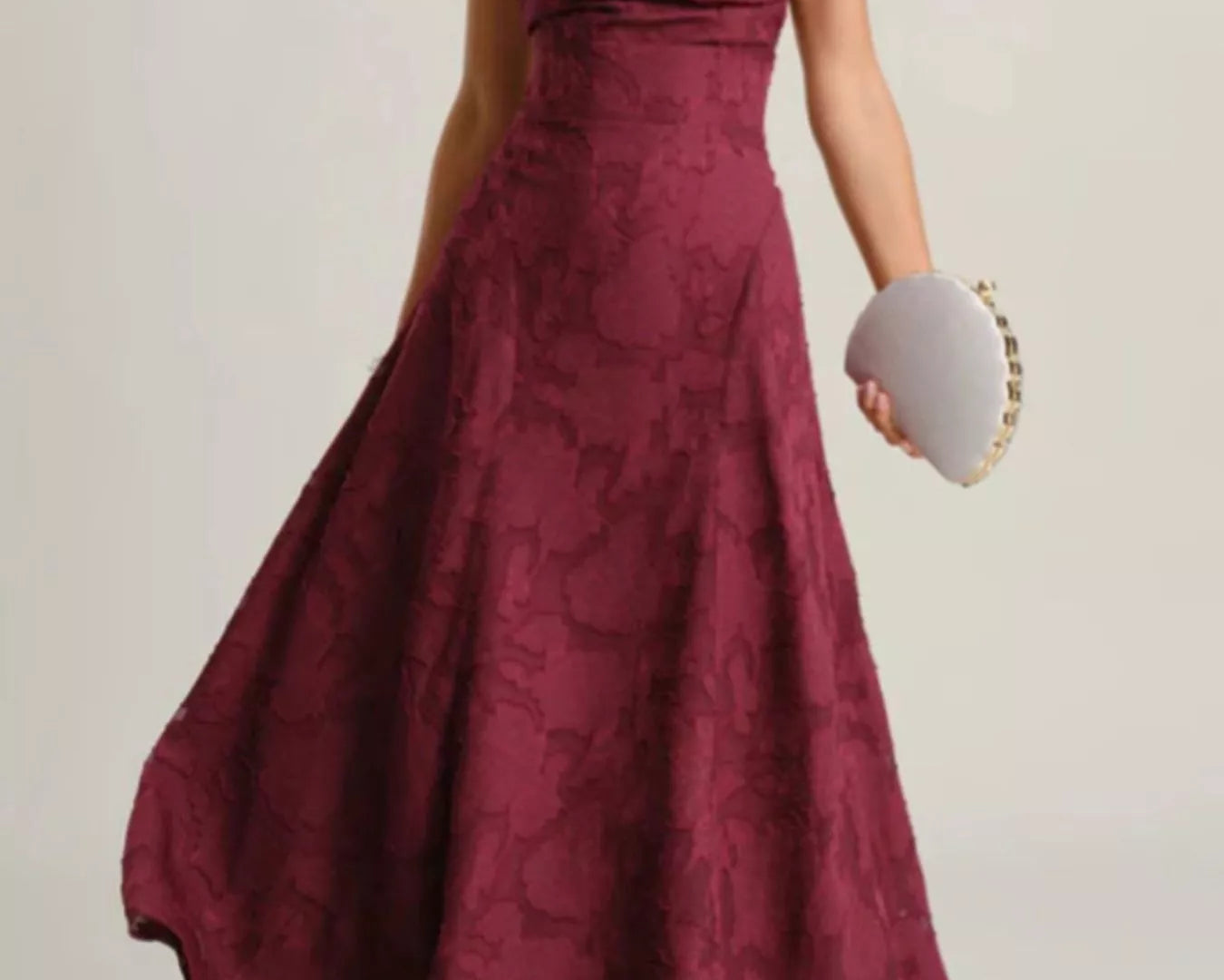 NEWYORKLISTED STYLE COLLECTION: Maroon lace dress worn by a person on a plain background