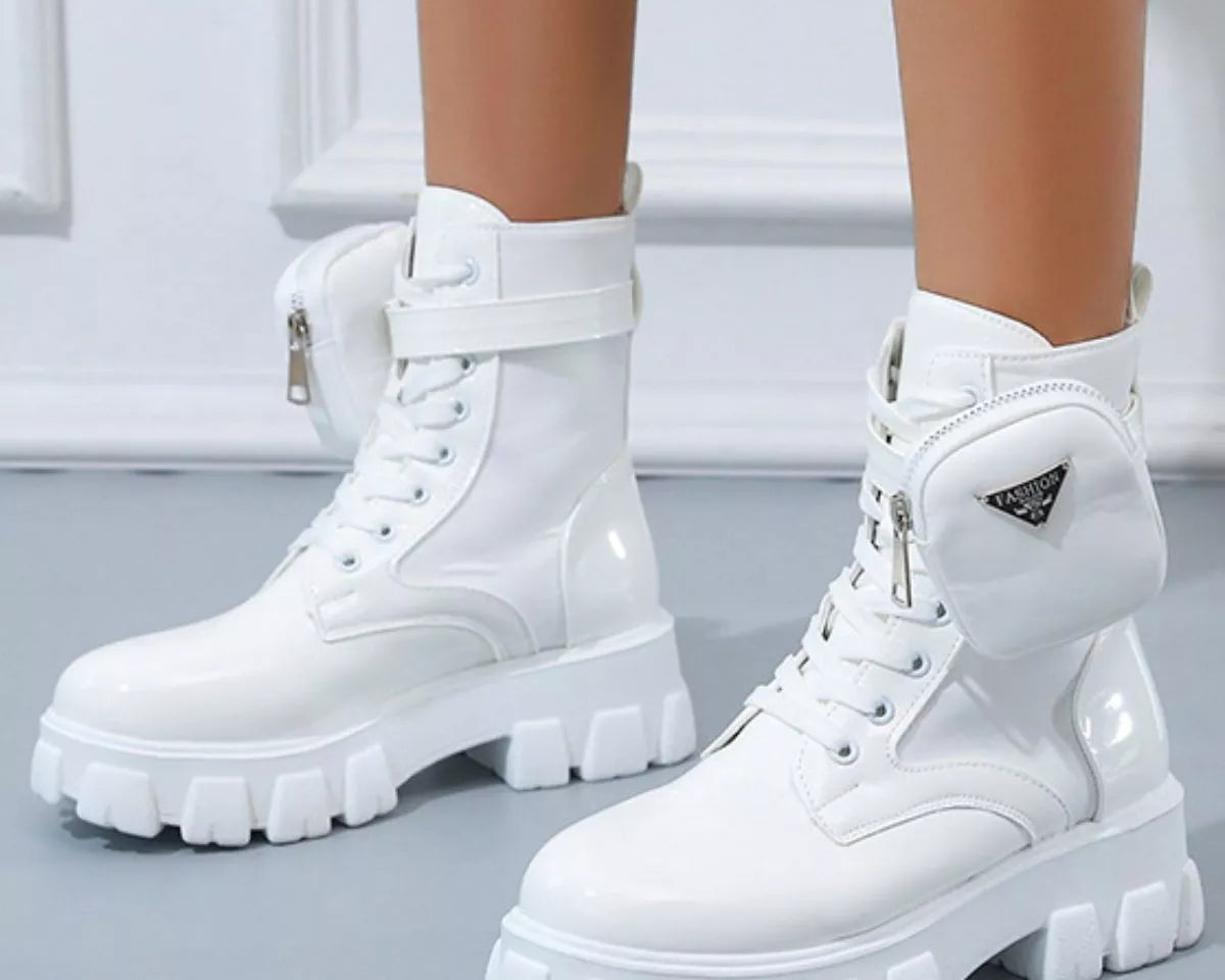 NEWYORKLISTED SHOE COLLECTION: White platform boots with zippers on a light gray background