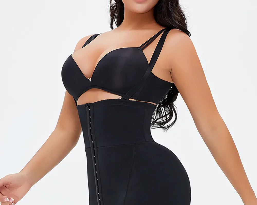 NEWYORKLISTED Intimate Apparel: Woman wearing a black shapewear bodysuit on a white background