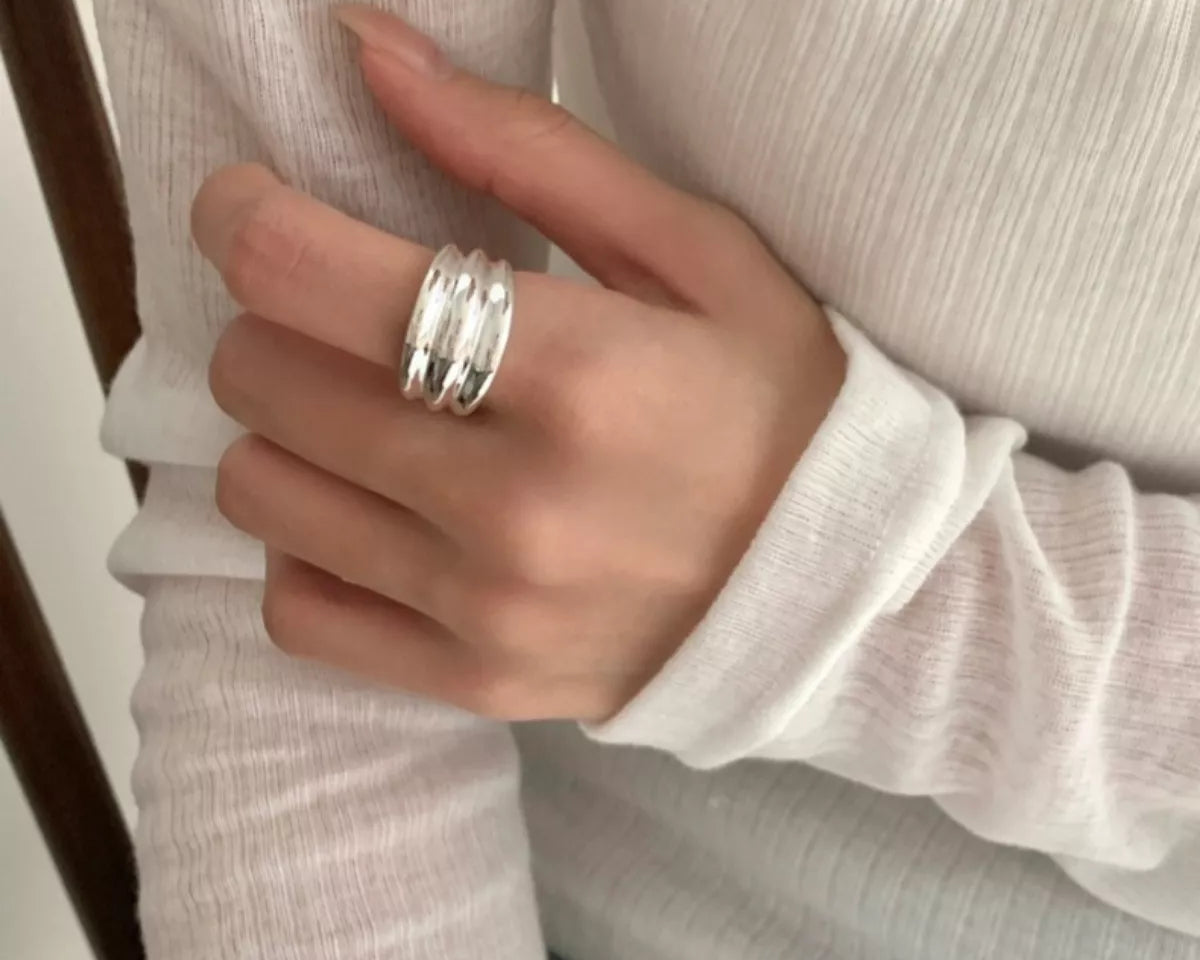 NYLD Glamour Collection: Model is wearing sterling silver modern design ring.