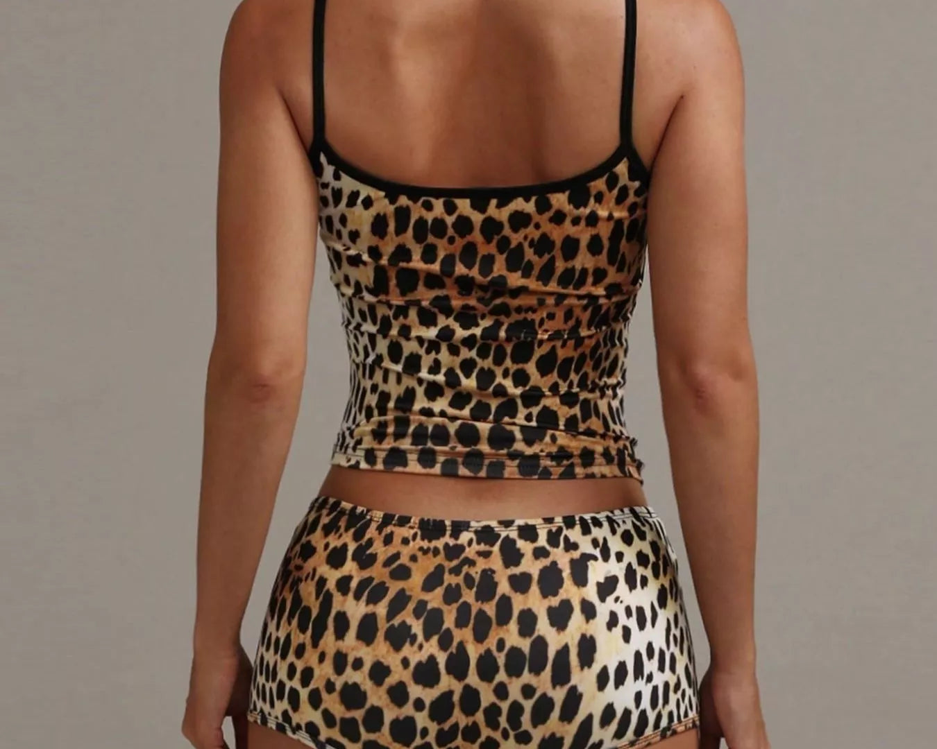 NEWYORKLISTED INTIMATE APPAREL COLLECTION: Leopard print lingerie set on a plain background