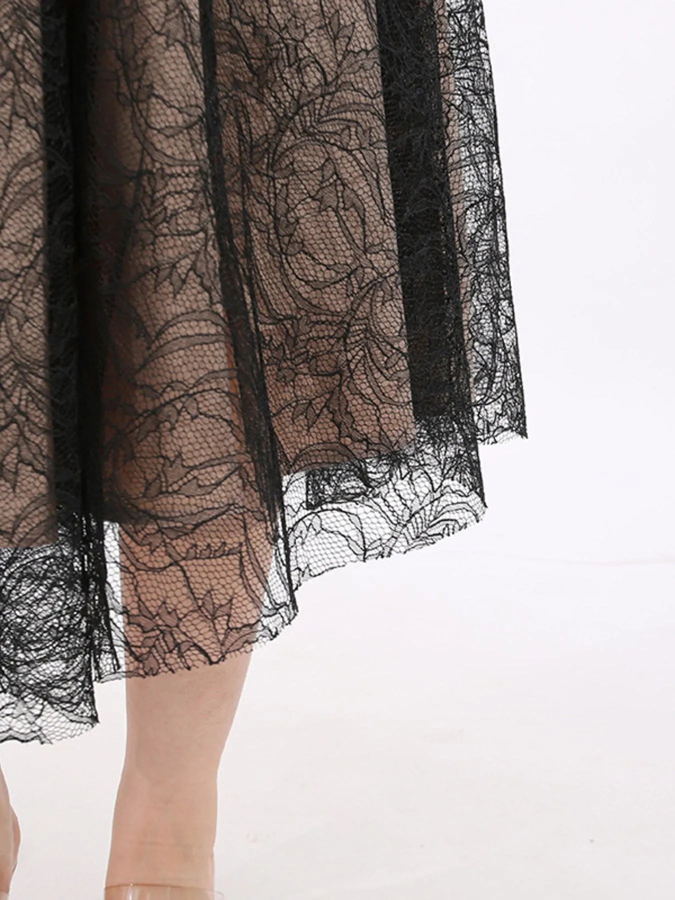 NEWYORKLISTED RUNWAY STYLE: Black lace skirt on a white background