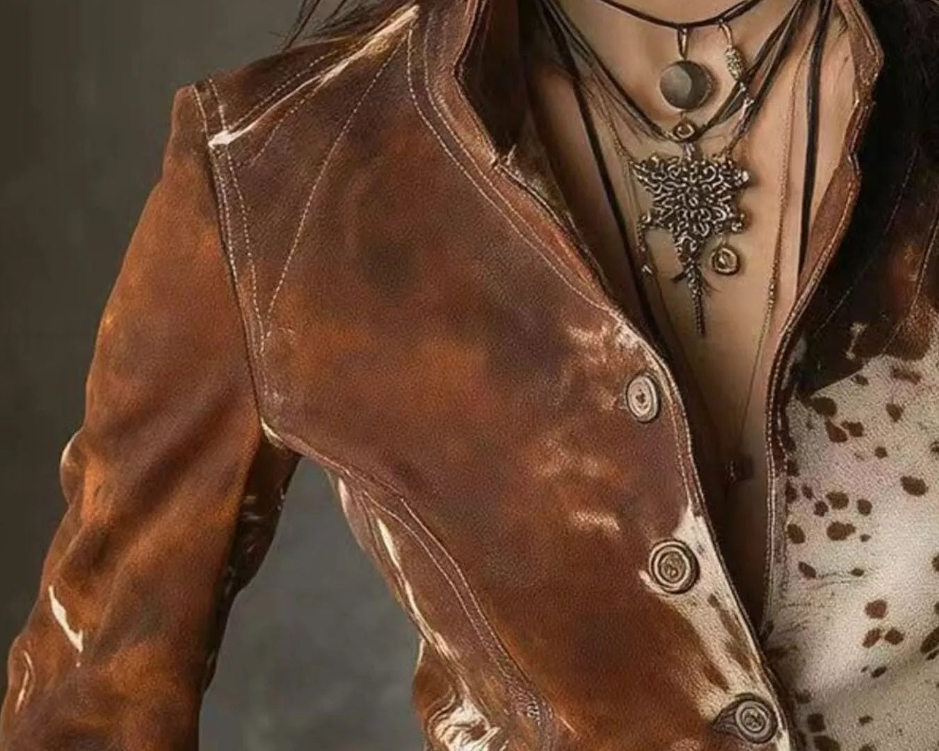 NEWYORKLISTED STYLE COLLECTION: Close-up of a person wearing a brown leather jacket with a dark background