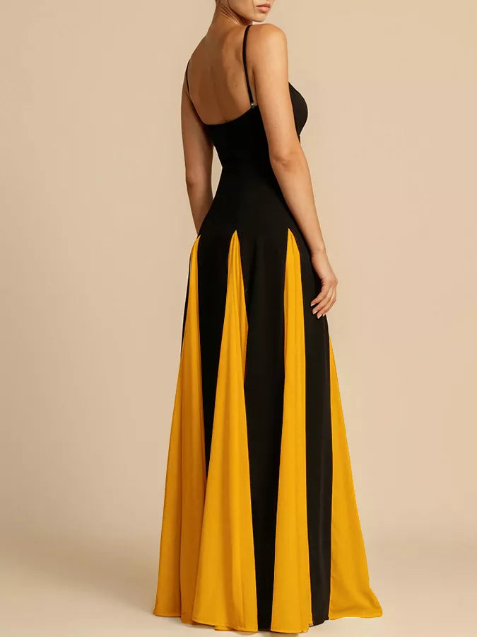 NEWYORKLISTED STYLE COLLECTION: Black and yellow dress with a slit on a beige background