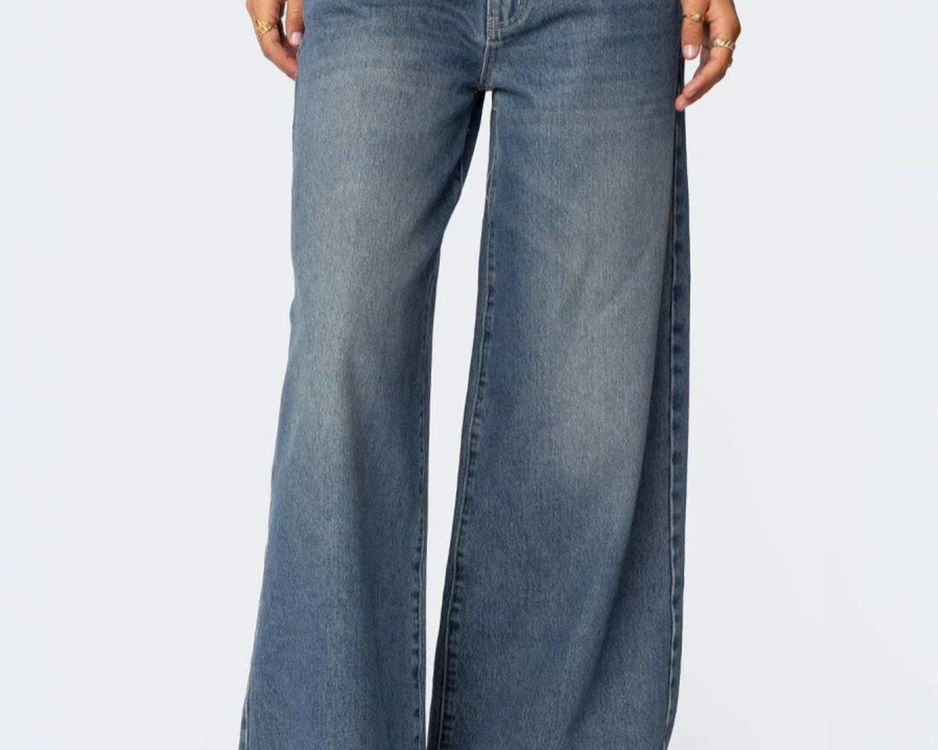 NEWYORKLISTED STYLE COLLECTION: Wide-leg jeans worn by a person on a white background
