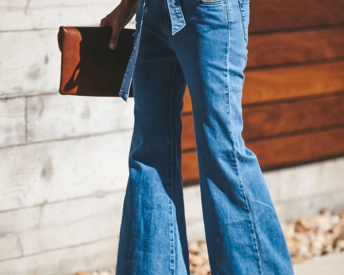 High-Waisted Tie-Front Flare Jeans from the NEWYORKLISTED STYLE COLLECTION. Waist-slimming bow detail, premium stretch denim, and elongated flare silhouette. Shop luxury-inspired fashion at NEWYORKLISTED.COM