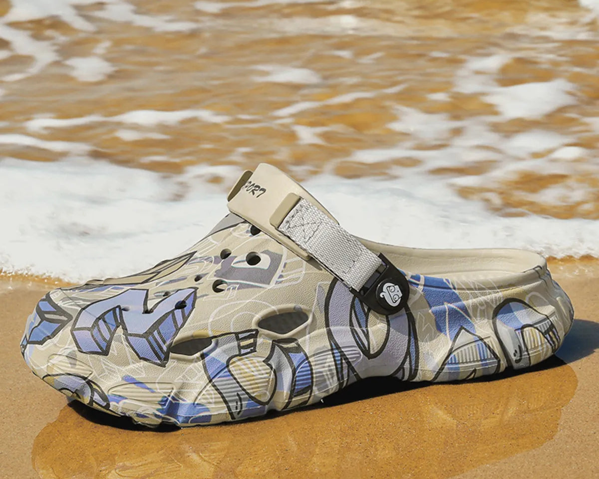 NEWYORKLISTED ATLAS MEN'S COLLECTION: Croc-style shoe with graphic design on a sandy beach