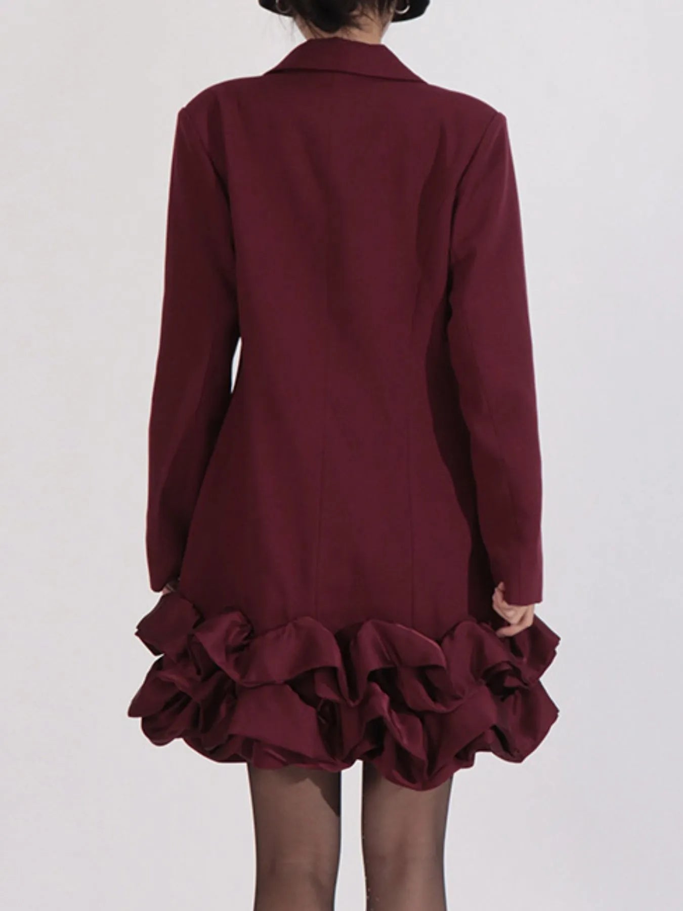 NEWYORKLISTED Runway Style: Maroon dress with ruffled skirt on a white background