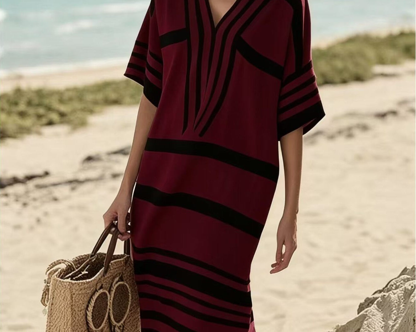 NEWYORKLISTED STYLE COLLECTION: Woman in a red and black striped dress on a beach