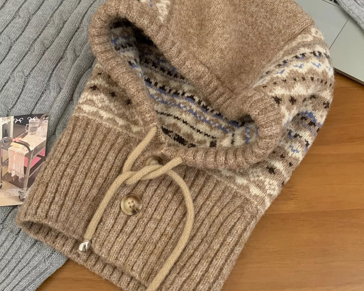 NEWYORKLISTED STYLE COLLECTION: Drawstring Knitted Winter Hat – Cozy, Chic & Cold-Weather Ready: Brown knitted sweater with a hood on a wooden surface