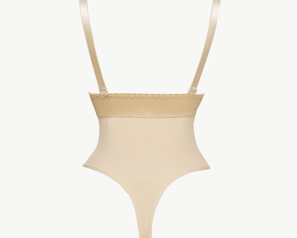 NEWYORKLISTED Intimate Apparel: Beige swimsuit with thin straps on a white background