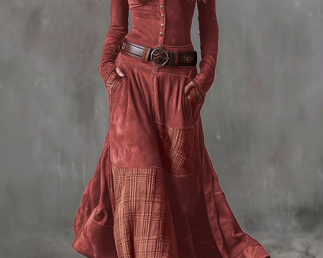 NEWYORKLISTED Style Collection: Woman wearing a long rust-colored dress with a plaid pattern against a gray background