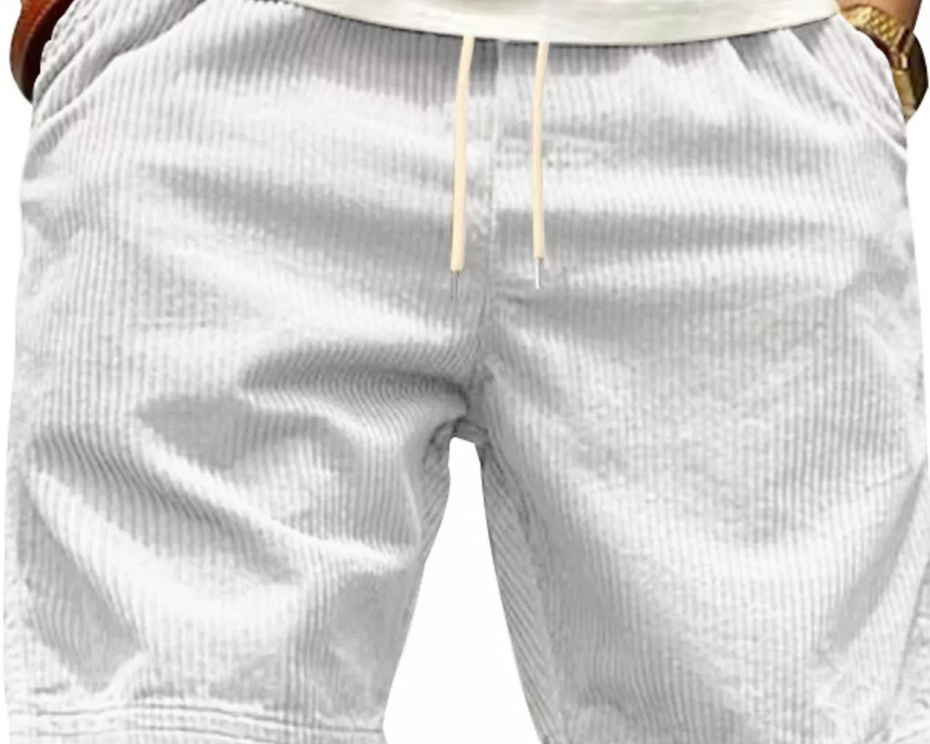 NEWYORKLISTED ATLAS MEN'S COLLECTION: White shorts worn by a person with a neutral background
