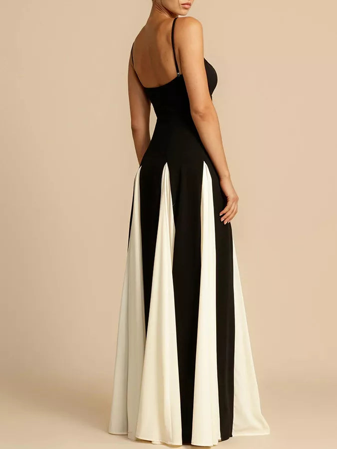 NEWYORKLISTED STYLE COLLECTION: Black and white dress with a high slit on a beige background