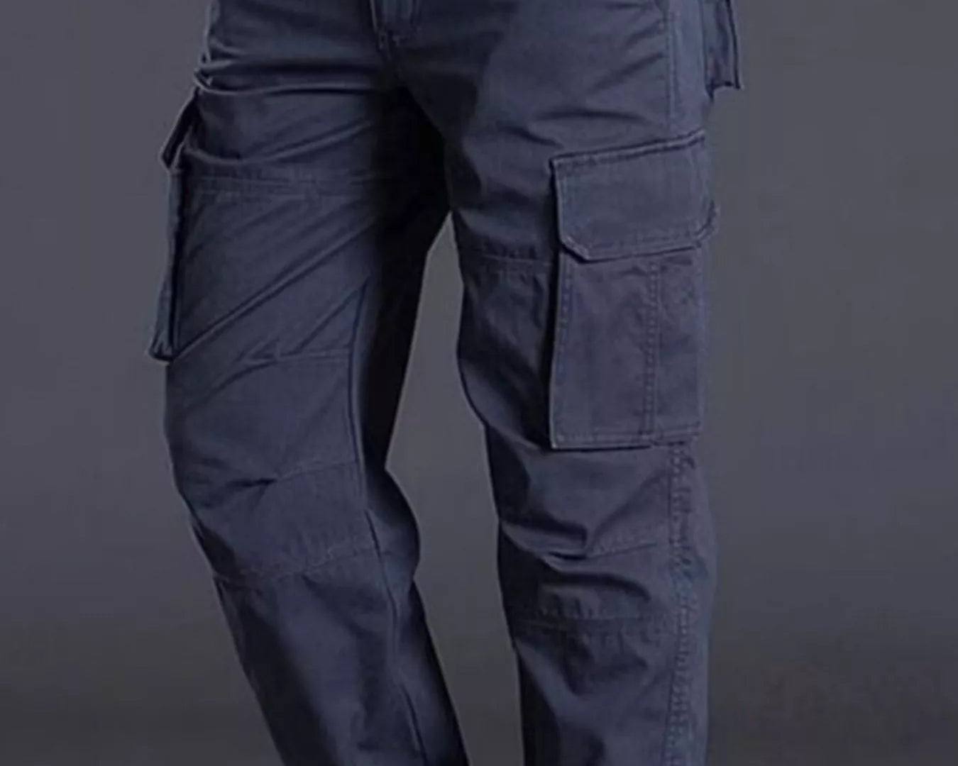 NEWYORKLISTED ATLAS MEN's COLLECTION: Person wearing dark blue cargo pants on a gray background