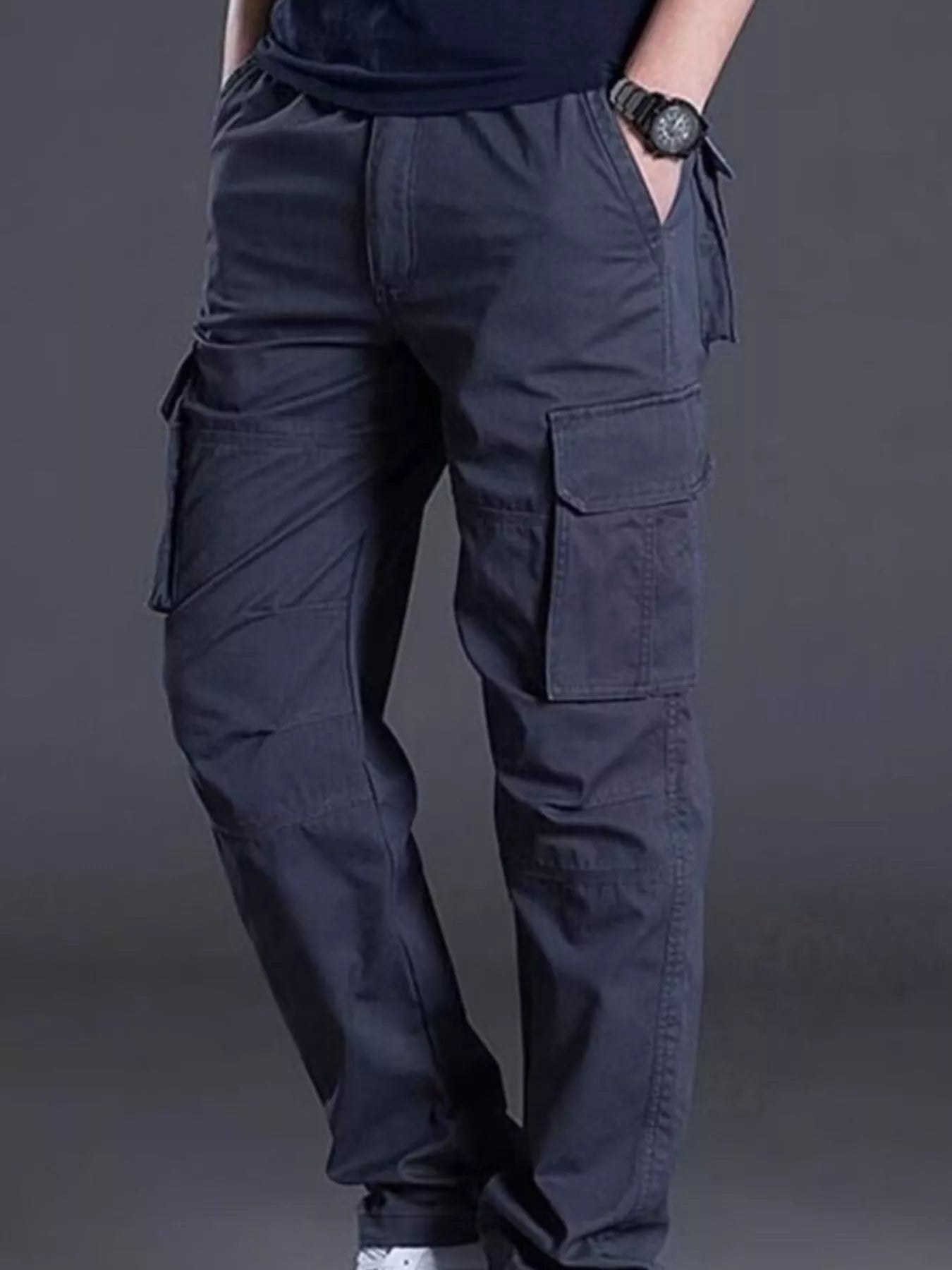 NEWYORKLISTED ATLAS MEN's COLLECTION: Person wearing dark blue cargo pants on a gray background