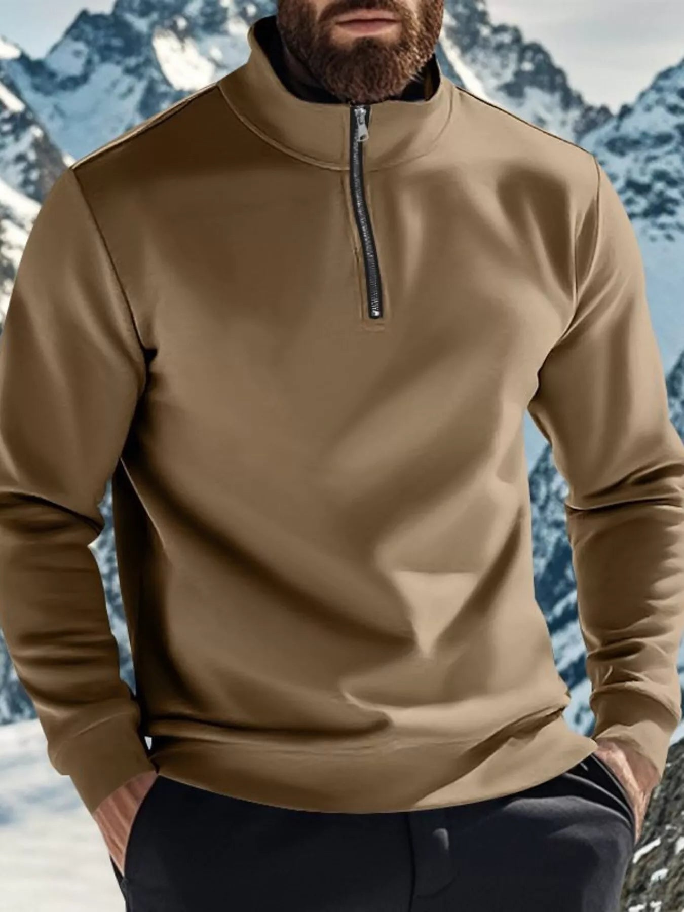 NEWYORKLISTED ATLAS MEN'S COLLECTION: Person wearing a beige pullover with a mountainous background