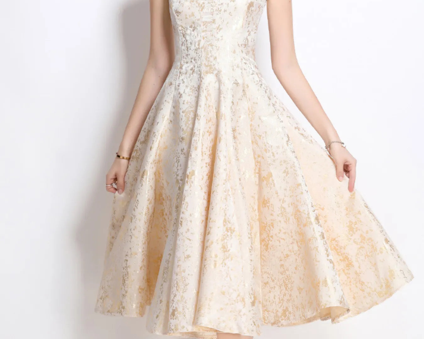 NEWYORKLSITED STYLE COLLECTION: Woman wearing a beige lace dress against a white background