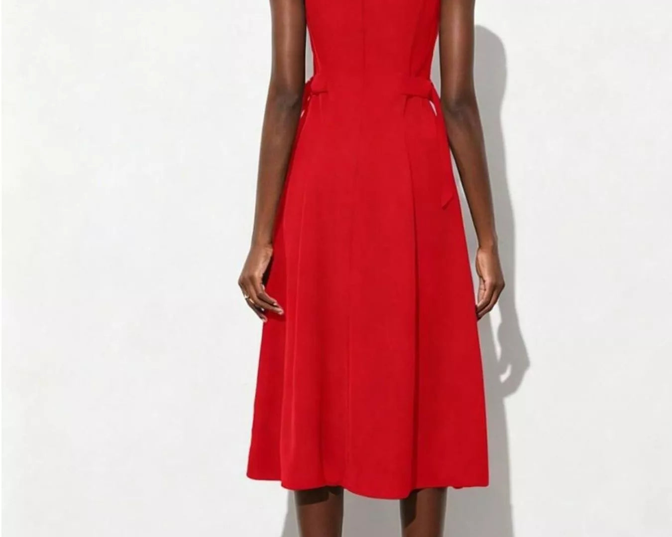 NEWYORKLISTED STYLE COLLECTION: Red dress worn by a person on a white background
