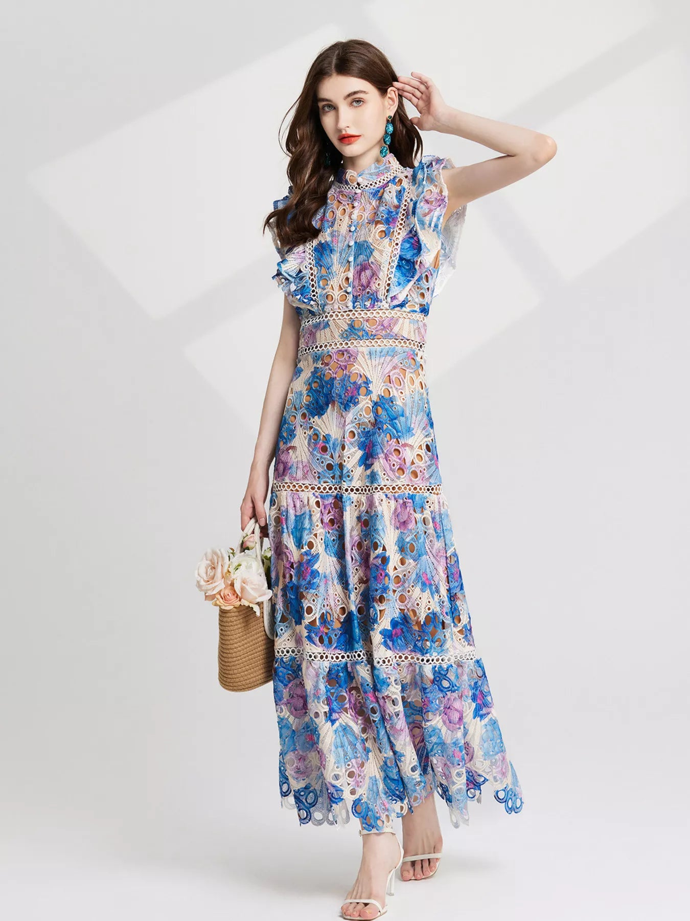 NEWYORKLISTED STYLE COLLECTION: Woman wearing a floral dress on a white background