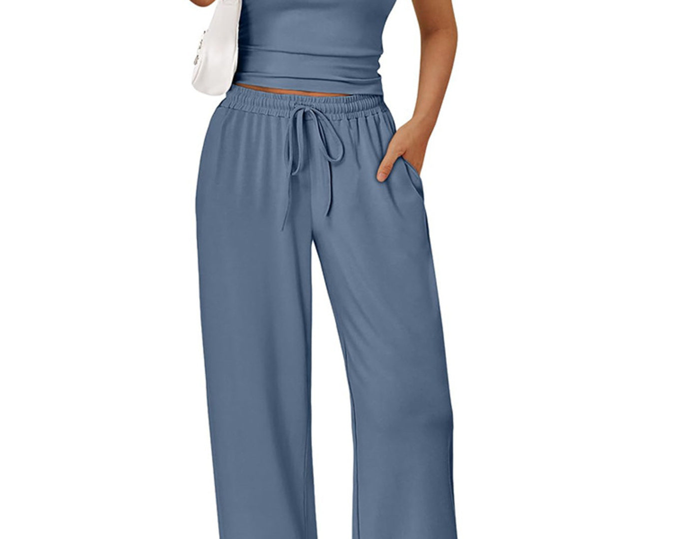 NEWYORKLISTED COMFORT COLLECTION: Woman wearing a blue outfit with wide-leg pants and a matching top on a white background