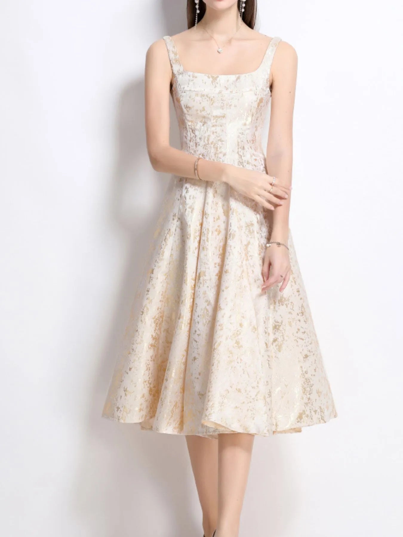 NEWYORKLISTED STYLE COLLECTION: Woman wearing a floral dress against a white background