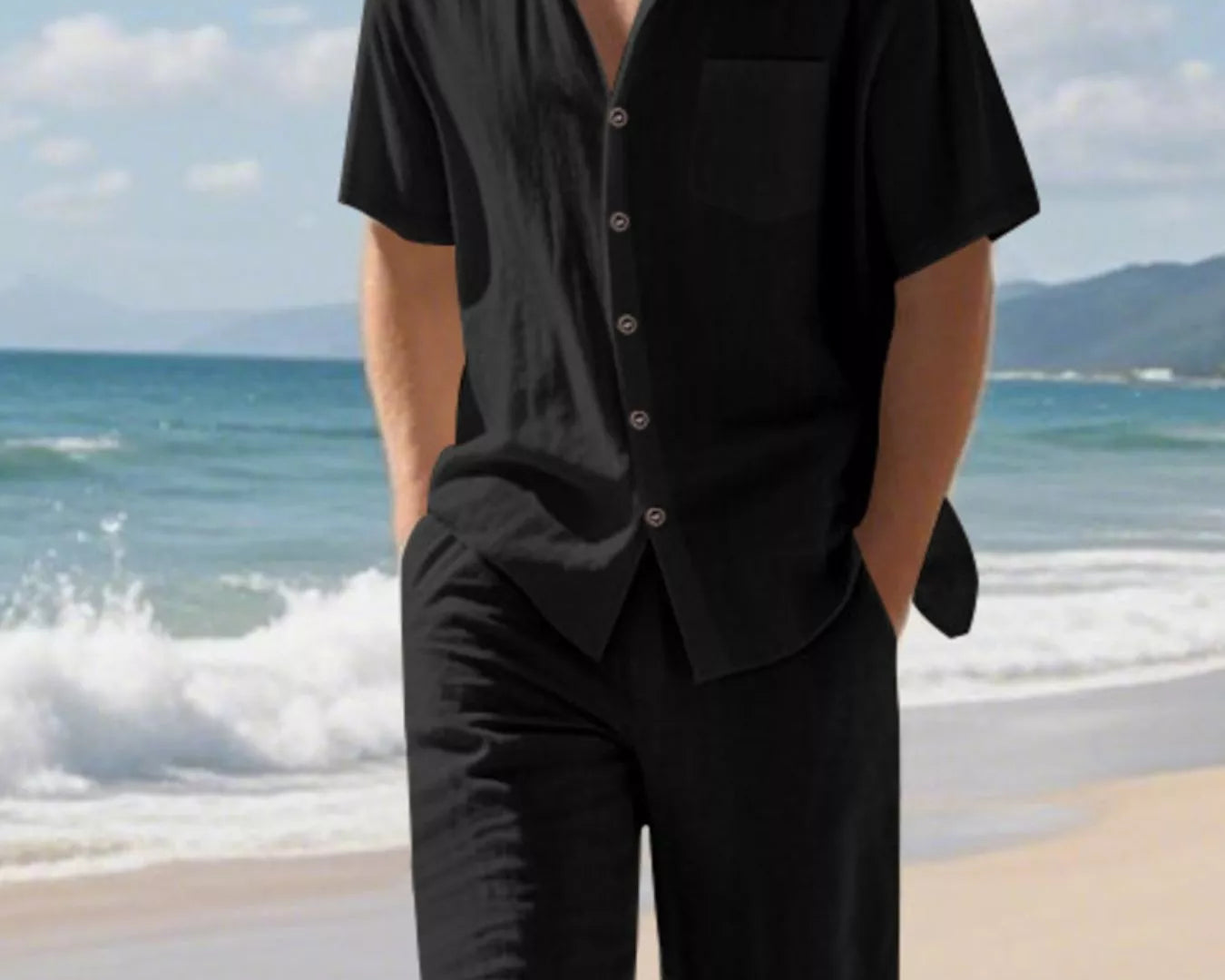 NEWYORKLISTED ATLAS MEN'S COLLECTION: Man wearing a black shirt and shorts on a beach