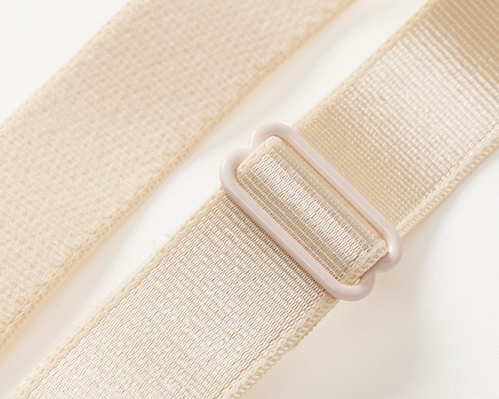 NEWYORKLISTED Intimate Apparel: Beige belt with a plastic buckle on a light gray background