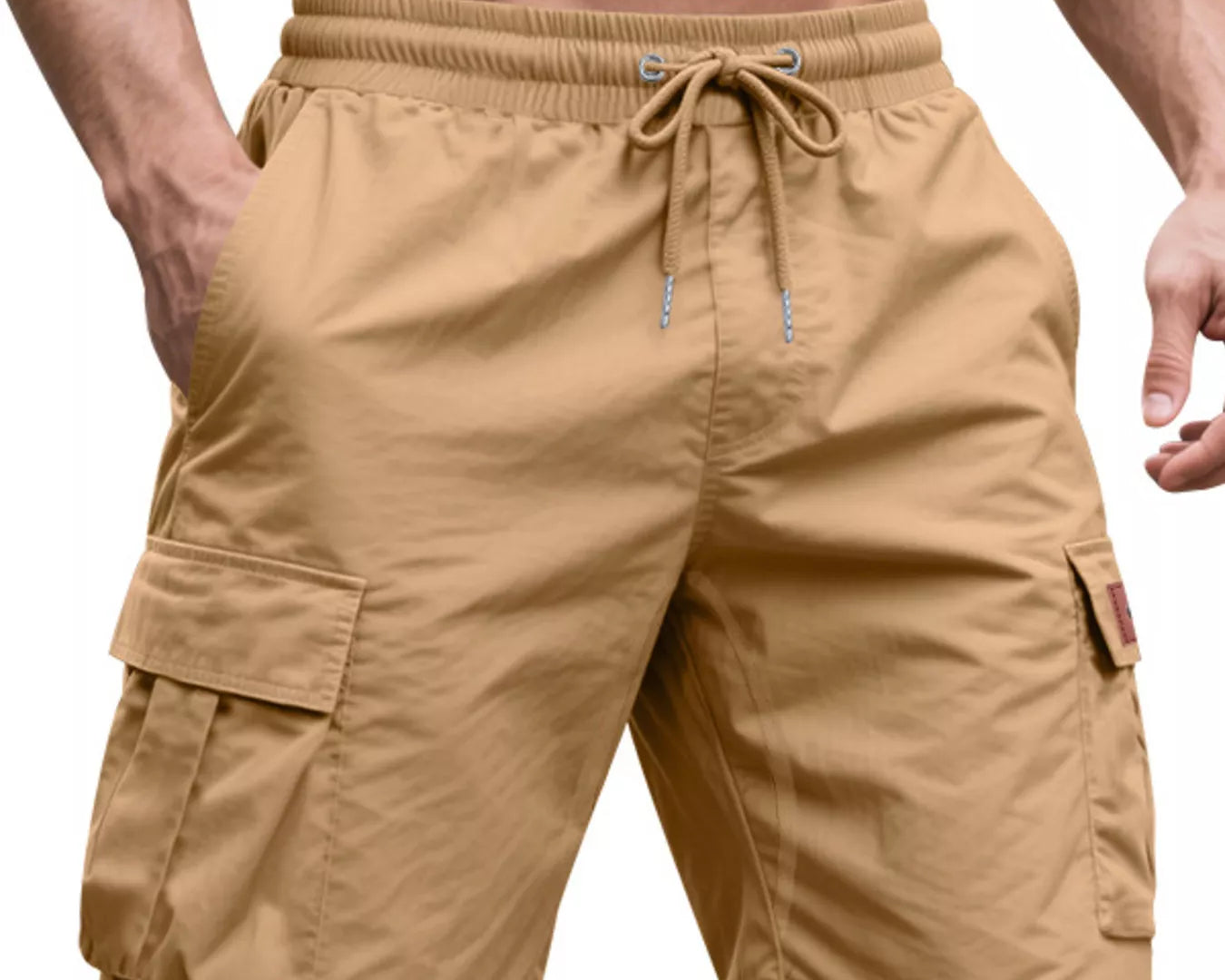 NEWYORKLISTED ATLAS MEN'S COLLECTION: Tan cargo shorts worn by a person on a white background