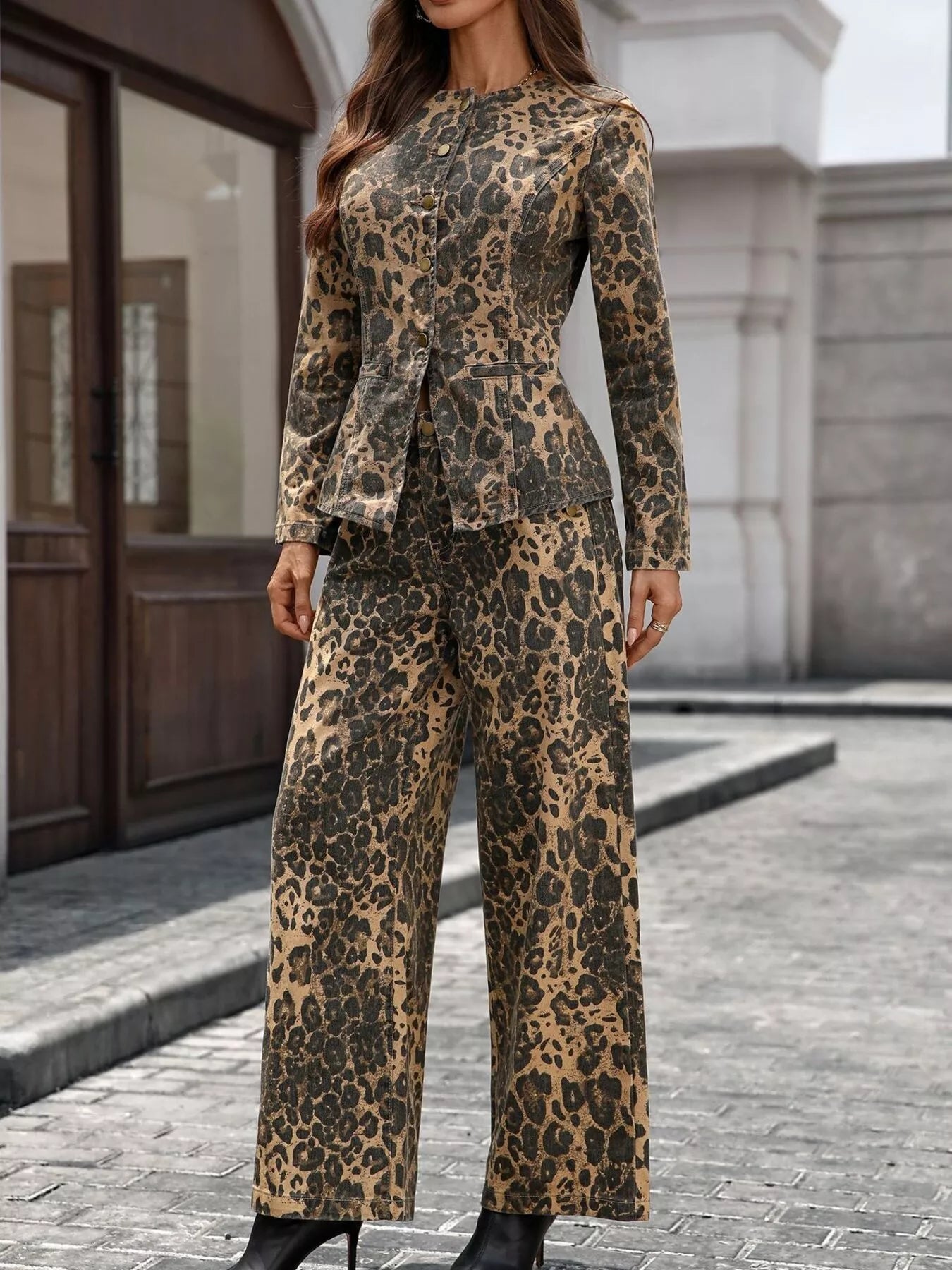 NEWYORKLISTED STYLE COLLECTION: Person wearing a leopard print suit standing on a street.