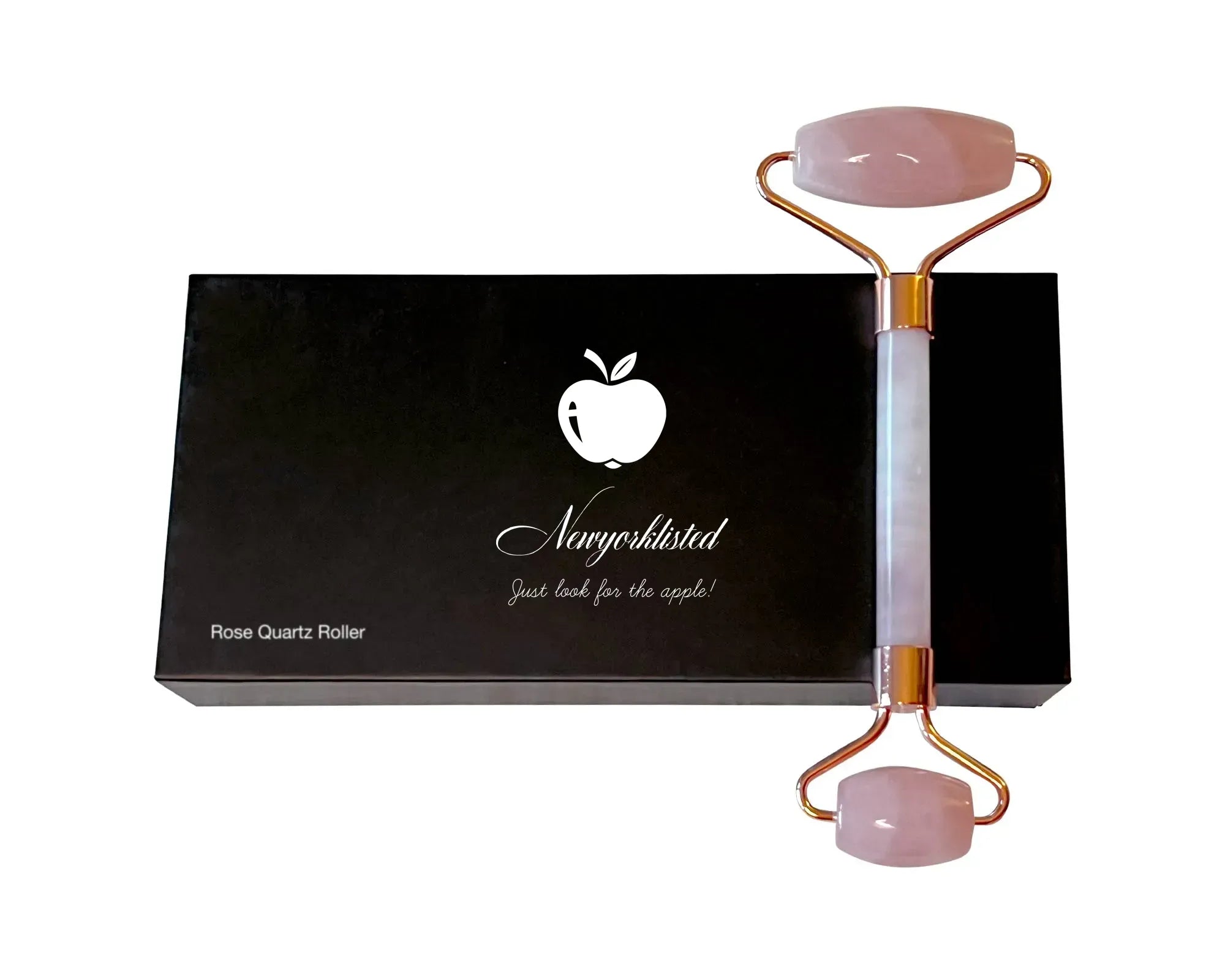 NEWYORKLISTED Cosmetic Collection: Rose Quartz Roller with gold accents on a black box featuring the NEWYORKLISTED white apple logo.