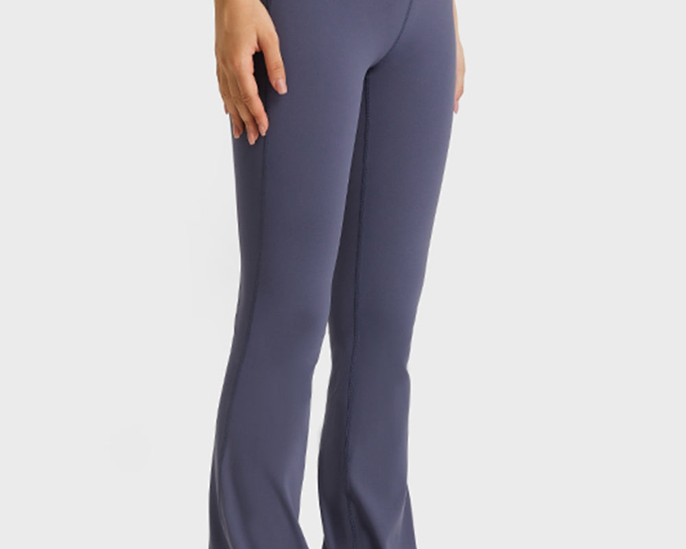 NEWYORKLISTED ACTIVEWEAR COLLECTION: Person wearing high-waisted flared pants on a white background