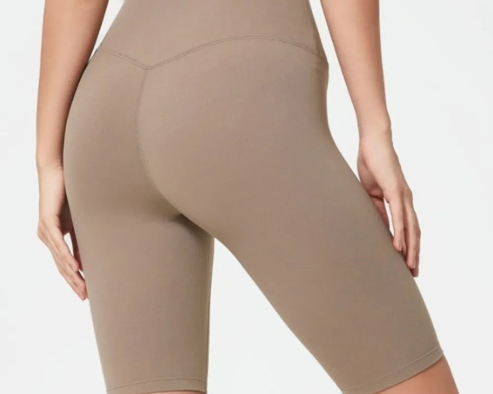 NEWYORKLISTED ACTIVEWEAR COLLECTION: Beige athletic shorts worn by a person on a light gray background