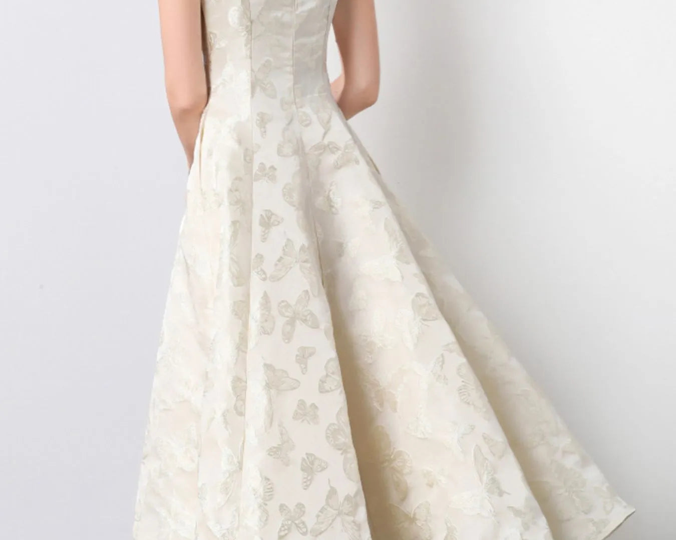 NEWYORKLISTED STYLE COLLECTION: White lace dress on a plain background