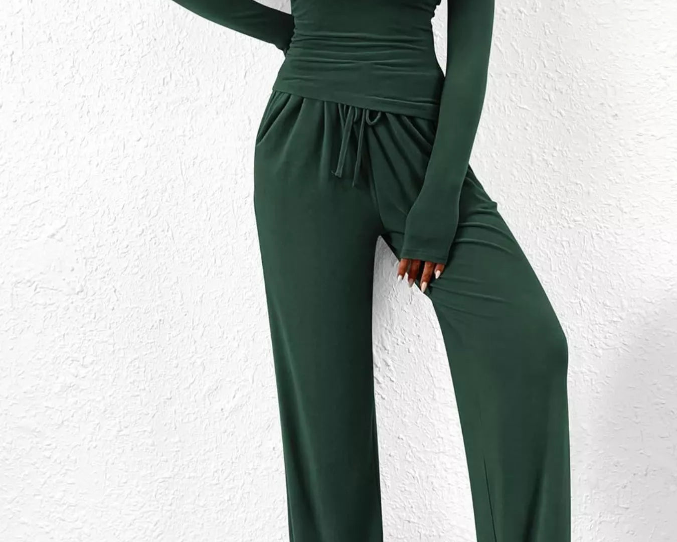 NEWYORKLISTED COMFORT COLLECTION: Long Sleeve Top and Wide Leg Pants Set: Green jumpsuit worn by a person against a white wall.