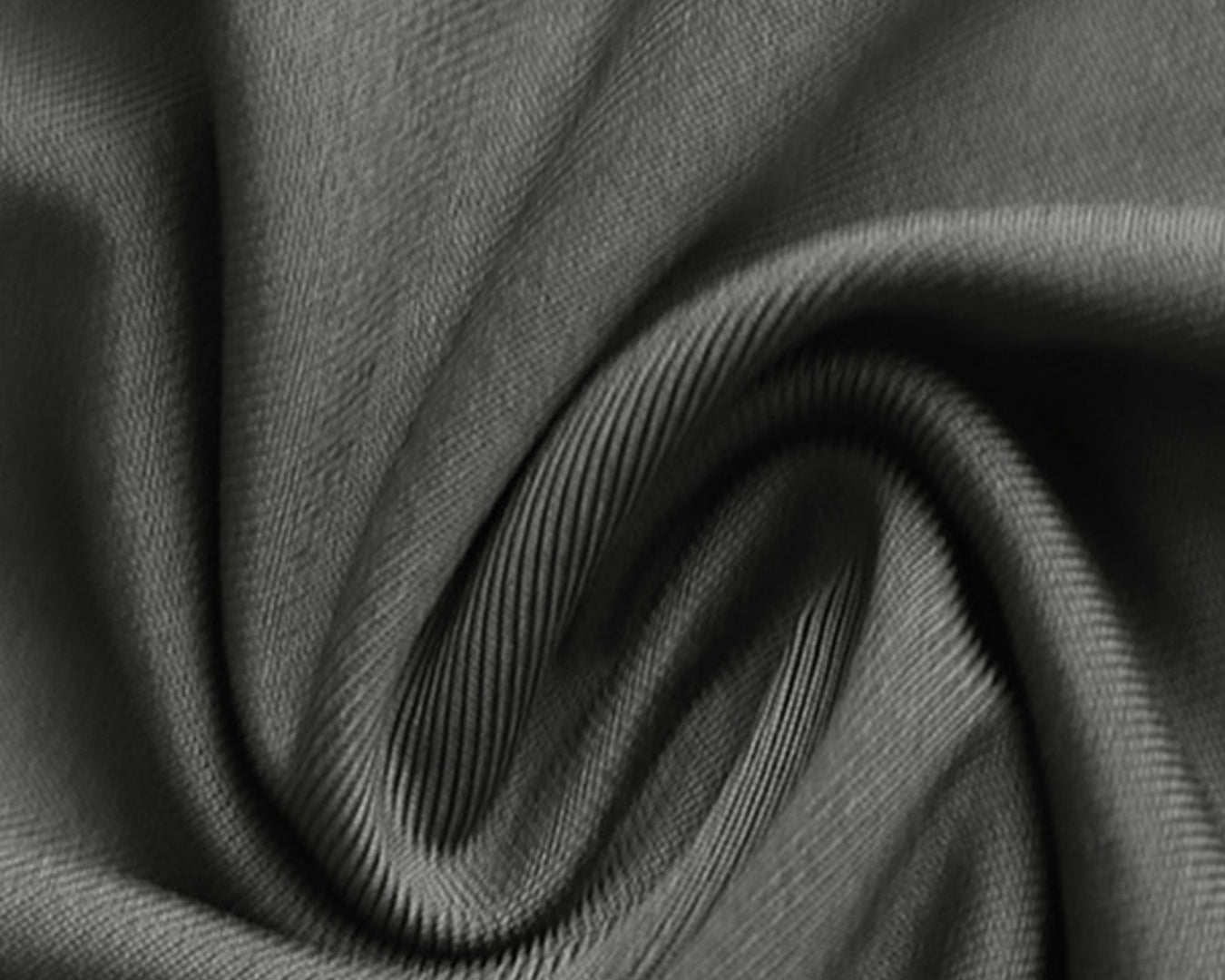 Close-up of dark gray fabric with folds