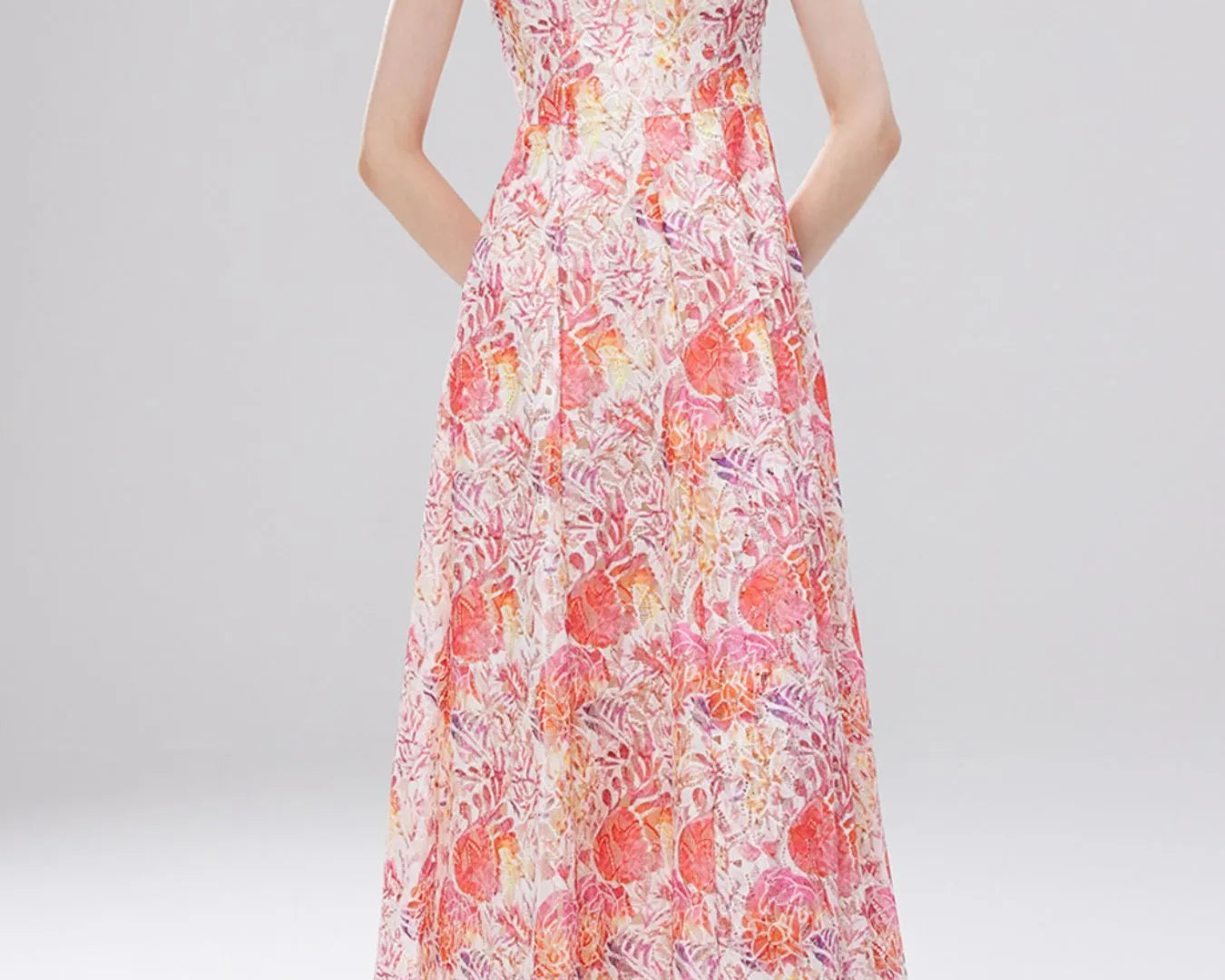 NEWYORKLISTED STYLE COLLECTION: Woman wearing a floral dress on a white background