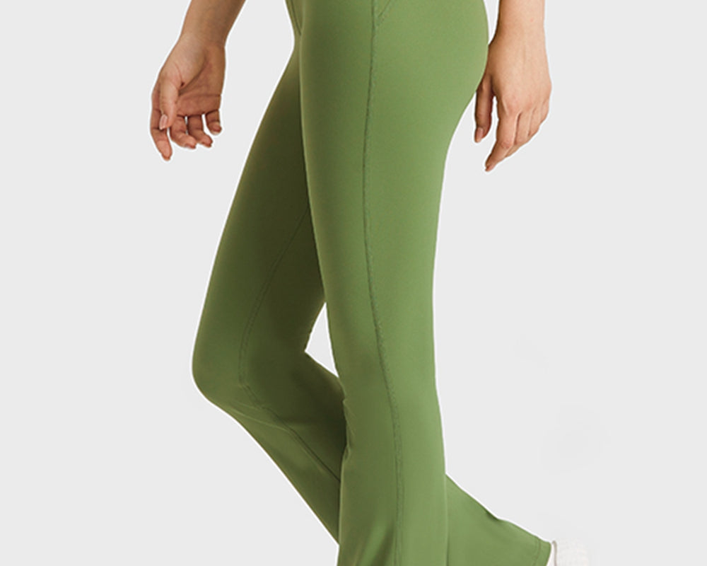 NEWYORKLISTED ACTIVEWEAR COLLECTION: Green flared pants worn by a person on a white background
