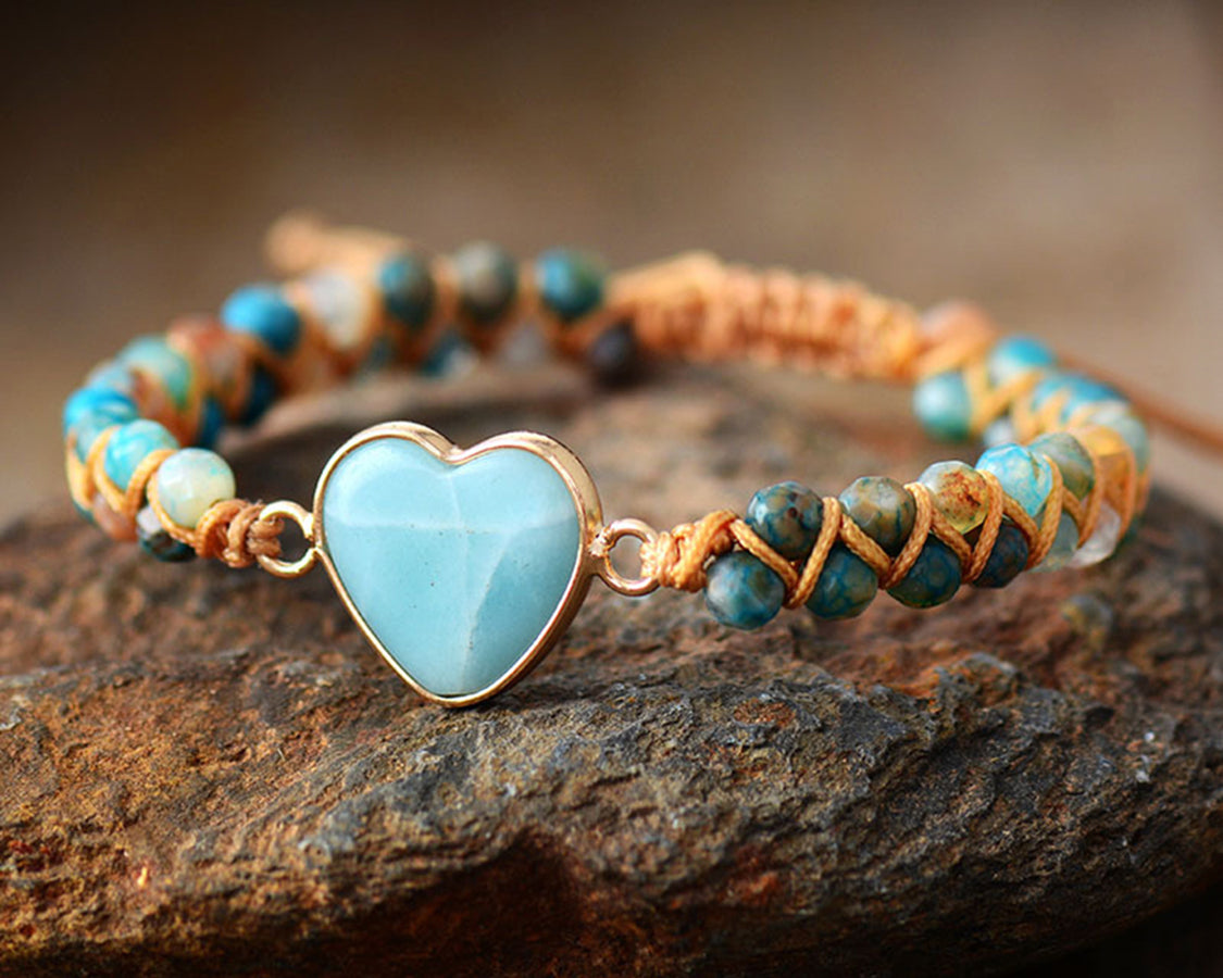 NEWYORKLISTED Valentine’s Day Specials: Bracelet with heart-shaped turquoise charm on a stone surface