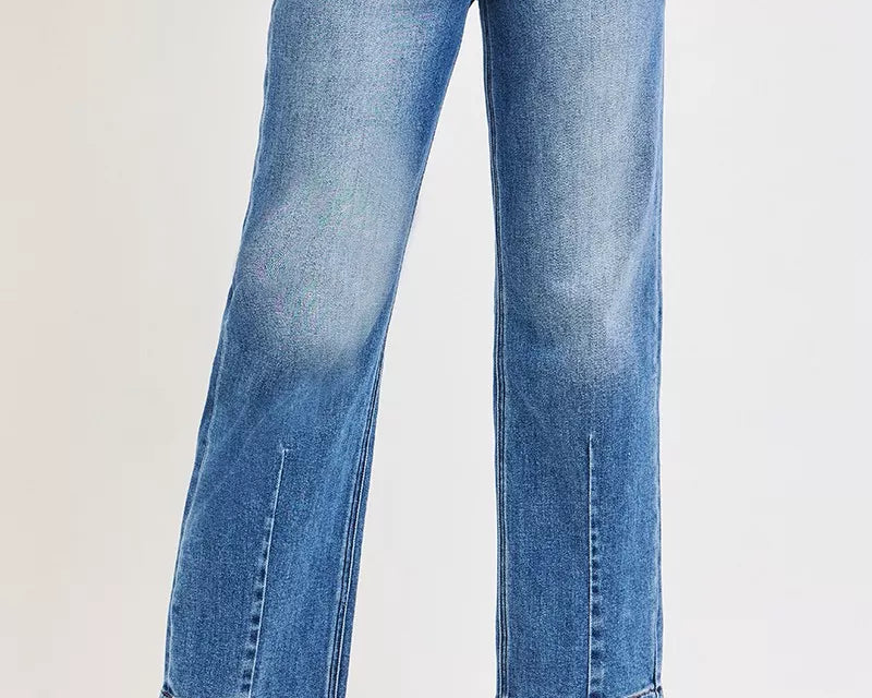 NEWYORKLISTED DENIM COLLECTION: Blue jeans worn by a person on a white background