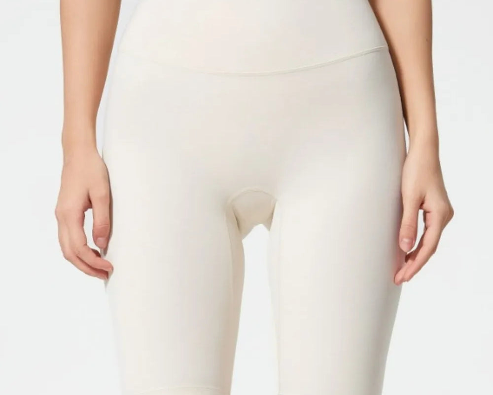 NEWYORKLISTED ACTIVEWEAR COLLECTION: Person wearing white athletic shorts on a plain background